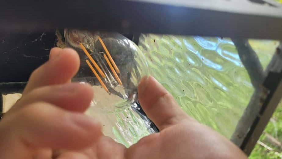 Unscrewing a light bulb
